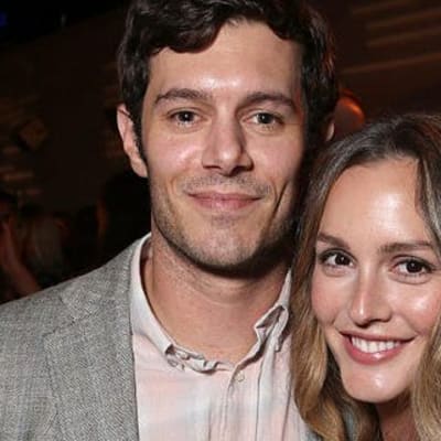 Leighton Meester's charm shines as Adam Brody reveals how she fuels his irresistible charisma! Dive into their playful banter and discover the secret behind their enchanting love!
