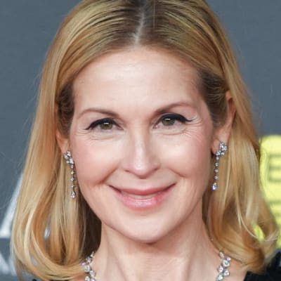 Kelly Rutherford dazzles at the 78th BAFTA Awards in London! Her stunning outfit and radiant smile stole the spotlight. Don't miss the glamorous moments from this unforgettable night!